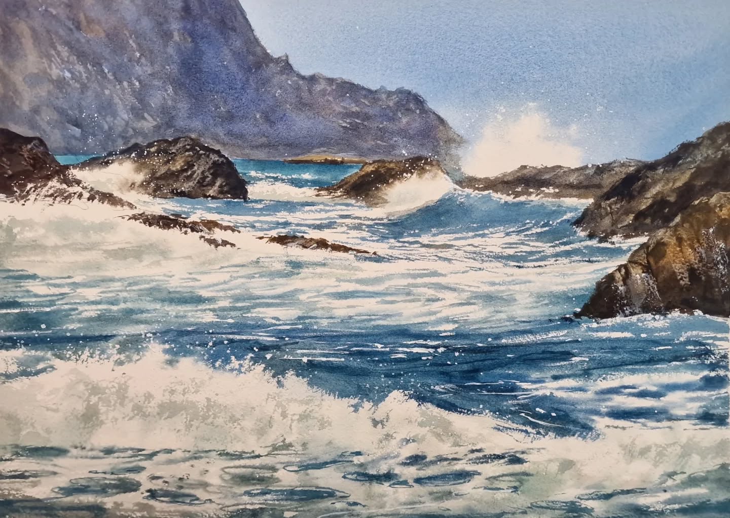 Crashing waves against dark rocks under a misty cliff, watercolor by Pablo Rubén — restless sea in cobalt and prussian blue